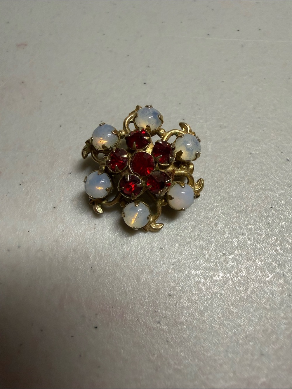 Vintage Gold-Tone Brooch with Red and Opalescent Stones
